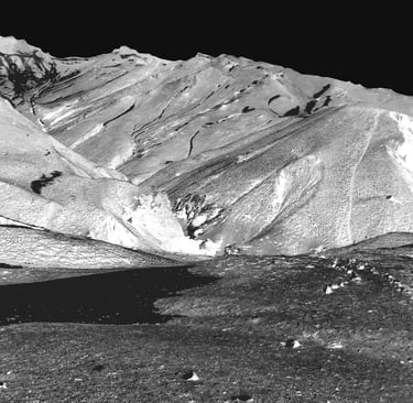 a black and white photo of a mountain range