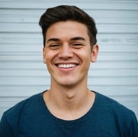 a man with a blue shirt and a white shirt
