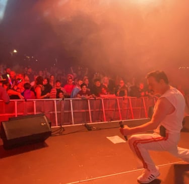 A top Freddie Mercury tribute singer entertains the crowd a a huge outdoor festival