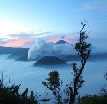 a mountain range with a view of a valley