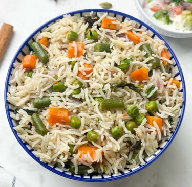 Vegetable Pulao, a fragrant, one-pot rice dish cooked with a medley of fresh vegetables & spices.