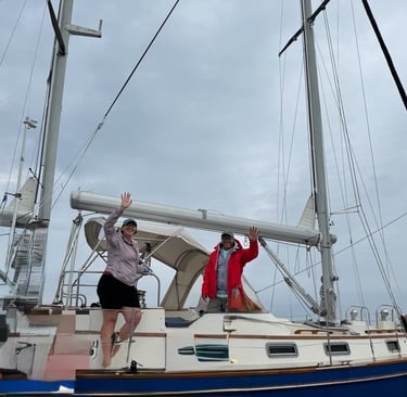 Two captains waving goodbye to their charter customers after a day on the waters of Buzzards Bay