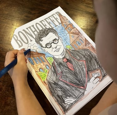 Child coloring in a Bonhoeffer drawing