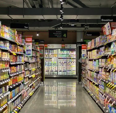 a grocery store aisle with a variety of products