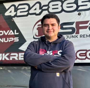 Uniformed SFC Junk Removal pro hauling attic junk in the Bay Area.