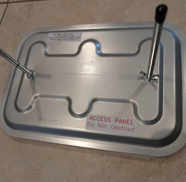 Photo of a kitchen exhaust access panel used to allow access to properly clean a section of ductwork