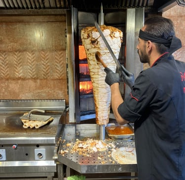 man making shawarma