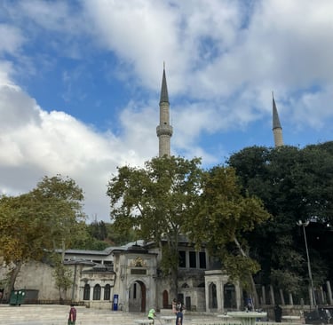 a large building with a tall tower with a clock tower