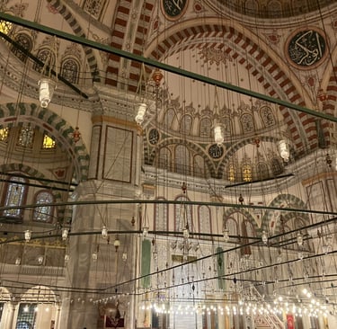 a large mosque interior with lights Fatih Istanbul