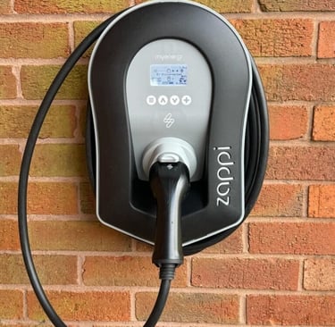 Wall-mounted EV charger installed on driveway in Dartford by Alma Electrical