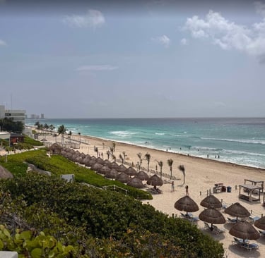 a beach with umbrellas and umbrellas on the beach