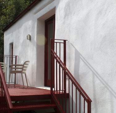 A private balcony with seating
