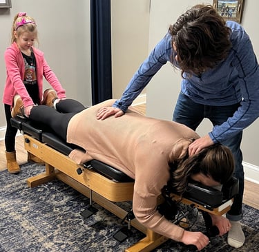 Expecting mom getting adjusted to reduce sciatica and prepare for birth
