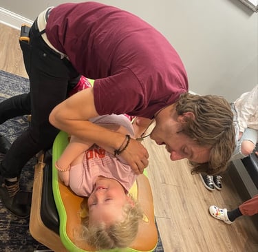 Franklin Pediatric Chiropractor adjusting child for Constipation and GI stress