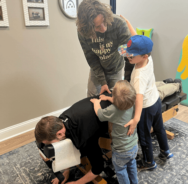 Adult receiving chiropractic care for anxiety, stress, or gut health in Franklin TN
