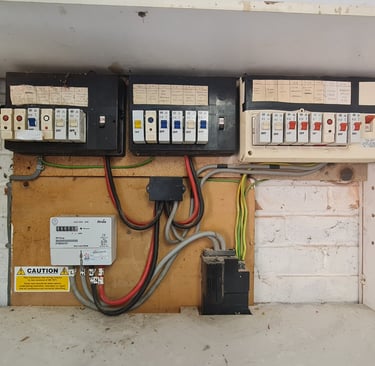 Old fuse boxes before a consumer unit upgrade in Bromley
