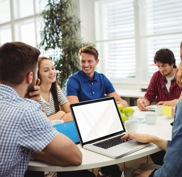 a group of people sitting around a table