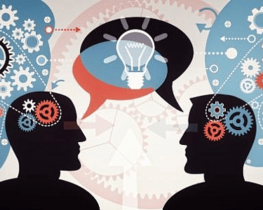 two people with gears and gears in their heads