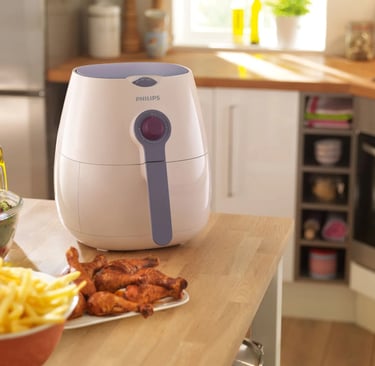 a kitchen counter top with a bowl of fries and a bowl of fries, first look the Phillips Airfryer