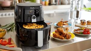 a kitchen counter top with a large air fryer