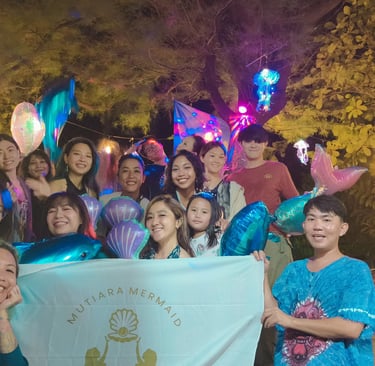 the Jakarta mermaid pod celebrating a birthday and all posing for a group picture