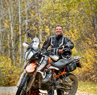 a man in a black jacket and a motorcycle