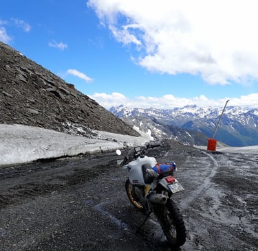 a motorcycle parked on a mountain side road