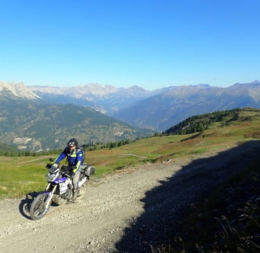 a person on a dirt bike on a dirt road