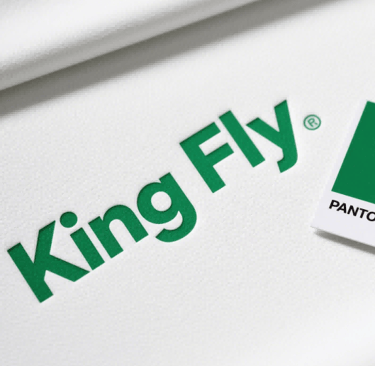 Crisp screen printing of the King Fly logo, showcasing vibrant PMS color matching.