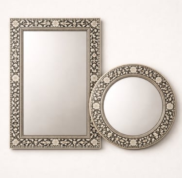 Decorative bone mirrors with carved borders and intricate inlay work.