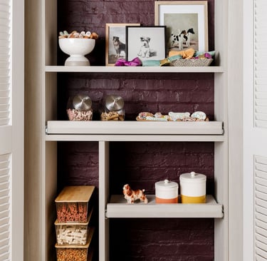 a kitchen with a brick wall and shelves with bowls of food