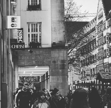 Black & white photo of busy streets in Europe, taken by artist LV