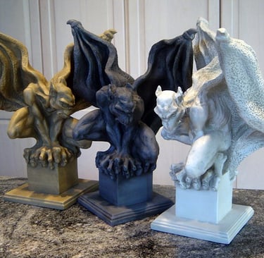 Three Sentinel Gargoyle Sculptures in three different colors.