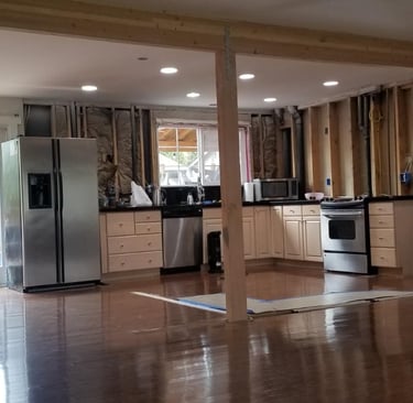 Home damage and home restoration after water damage. Water damage hardwood floors. Cabinets restore.
