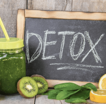 a chalkboard sign with a chalkboard saying detoxox