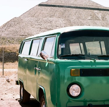 an old green Volkswagon minivan