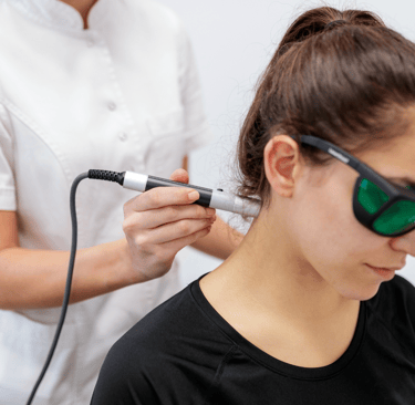 Laser therapy on patient's neck