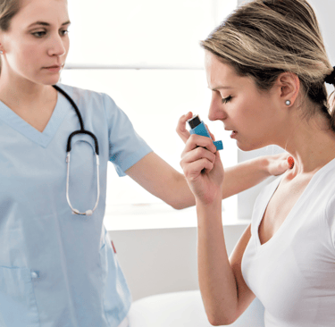 Asthma Woman with doctor at the hospital