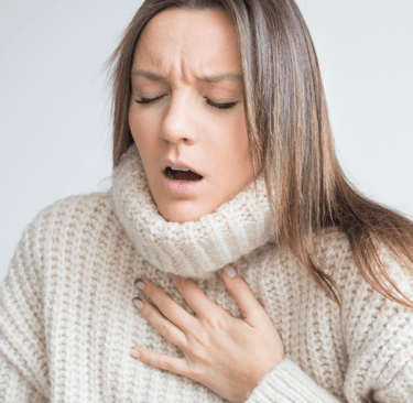 Woman having breath difficulties