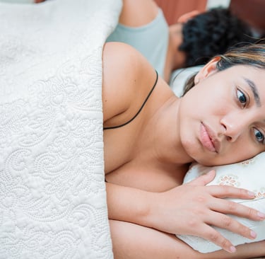 Upset couple sleeping on their backs