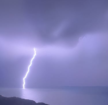 Powerful lightning strike over ocean at dusk, severe weather warning for wilderness survival and outdoor safety