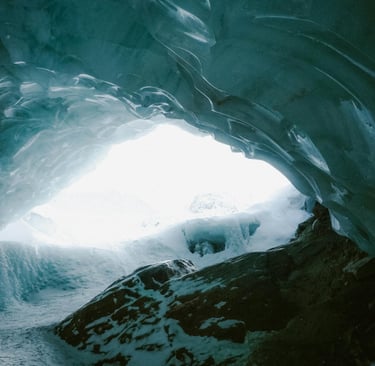 Frozen cave with snow and ice, representing shelter and navigation in extreme cold survival