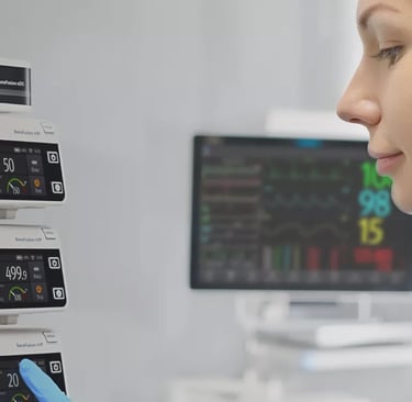 A medical professional monitoring a Mindray BeneFusion infusion pump system in a hospital setting.