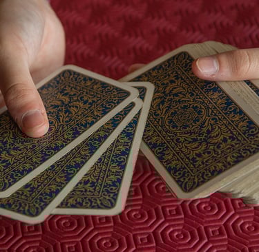 a person holding a card game of cards