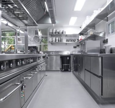 a kitchen with stainless steel appliances and stainless steel appliances