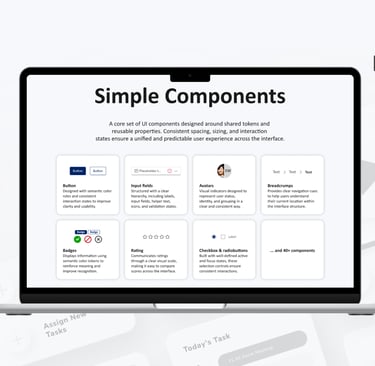 Laptop displaying a UI design system library with simple components like buttons, input fields, and badges.
