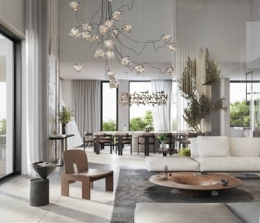 Sala de estar con grandes ventanales, sofá blanco y un sillón de madera marrón en el centro de la im