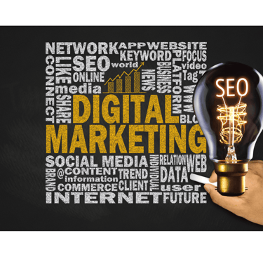 a person holding a light bulb in front of a blackboard with words that read