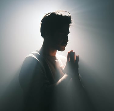 a man in a suit and tie is praying