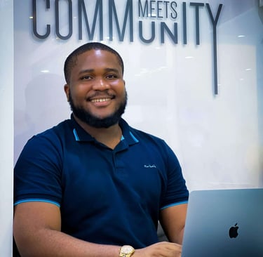 a man sitting at a desk with a laptop computer